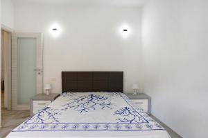 a bedroom with a large bed with two night stands at Vivere Lerici con parcheggio in Lerici