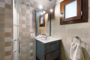 a bathroom with a sink and a mirror at Cueva El Desvelo in Tijarafe +22 photos