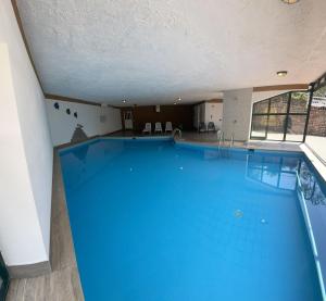 a large swimming pool in a building at Lola Home Brenzone in Brenzone sul Garda