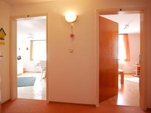 an open door into a living room with a hallway at Börsighof in Seebach +25 photos