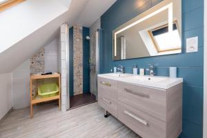 a bathroom with a sink and a mirror at Ty Laouen Gite Quiberon in Quiberon +23 photos