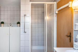 a bathroom with a shower and a sink at Ferienhaus Behrends in Emden +17 photos