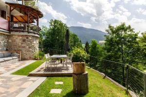 a patio with a table and chairs in a yard at Haus Auner Top 1 in Westendorf