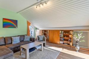 a living room with a couch and a table at Ferienwohnung am Kurpark Brilon in Brilon