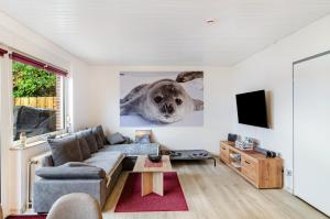 a living room with a seal on the wall at Perle von Berumbur in Berumbur