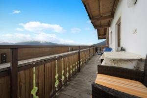 a balcony of a house with a view of the mountains at Apartment Dolomitenblick in Mühlbach