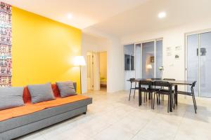 a living room with a couch and a table at Casa Io in Mindelo
