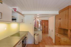 a kitchen with a sink and a counter at Schlierseehaus in Schliersee