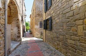 an alley in an old stone building at Villa sole e mare in Cipressa