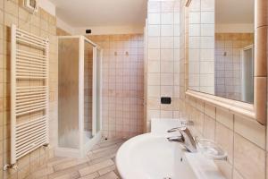a bathroom with a sink and a shower at Appartamento 8 in Livigno