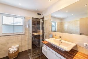 a bathroom with a sink and a shower at Casa Meeresbrise Marlow in Marlow +36 photos