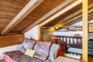 a living room with a couch and a table at Apartment Kracherlemoos in Seefeld in Tirol