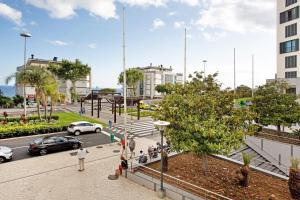 a rendering of a city street with cars at Apartamento Forum View in Funchal