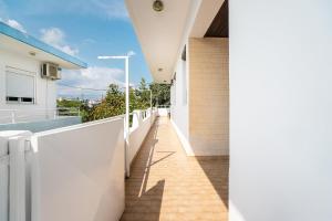 a hallway of a house with white walls at La Christine in Rhodes Town