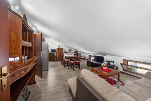a living room with a couch and a table at Casa Eleonora in San Sperate