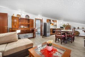 a living room with a couch and a table at Casa Eleonora in San Sperate