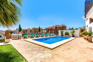 a swimming pool on the roof of a house at Studio Torreblanca close to beach in Fuengirola