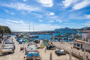 a marina with boats parked in the water at Es Port in Cala Ratjada