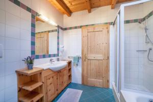 a bathroom with a sink and a shower at Ferienhaus Hof am Schloss in Prato allo Stelvio +23 photos