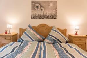 a bedroom with a bed with two night stands at Ferienwohnung Lilly in Garmisch