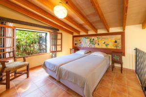 a bedroom with a large bed and a window at Acuario-Géminis in Llucmajor +43 photos
