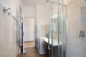 a bathroom with a toilet and a sink and a shower at Albenga Mary 43 6 in Albenga +15 photos