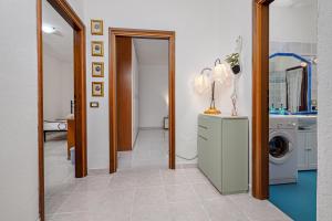 a laundry room with a washer and dryer at Casa Elisa in Padru +12 photos