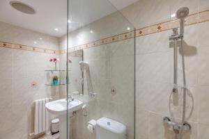 a bathroom with a shower and a toilet and a sink at Sant Antoni in Santanyi +18 photos