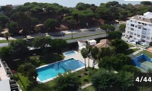 an aerial view of a building and a swimming pool at El Portil Pinares in El Portil