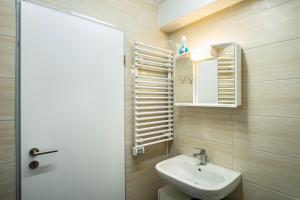 a bathroom with a sink and a mirror at Nguyen und Le in Neukirch +13 photos