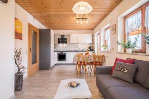 a living room with a couch and a table at Ferienwohnung Monninger in Langenargen