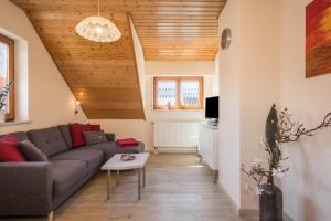 a living room with a couch and a table at Ferienwohnung Monninger in Langenargen