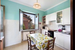 a kitchen with a table with a tablecloth on it at Casa Vera in Gavi