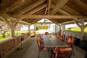 an outdoor dining area with a table and chairs at Ferienhaus Hulda in Öhningen