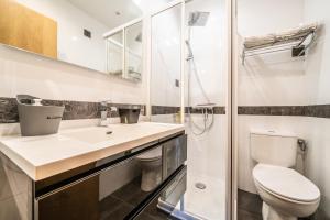 a bathroom with a toilet and a sink and a shower at Au Rêve Savoyard 1 - 2 personnes in Morillon