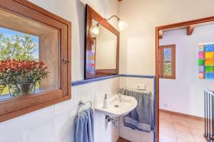 a bathroom with a sink and a mirror at Casa Catalina in Sóller +15 photos