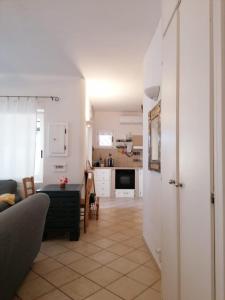 a living room with a couch and a table at Costa dei Monaci Villas - Tropea in Parghelia