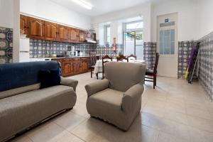 a living room with a couch and a table at Sé Heritage in Angra do Heroísmo