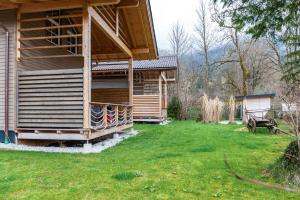 a house in a yard with a green lawn at Chalet Rauschn 2 in Farchant