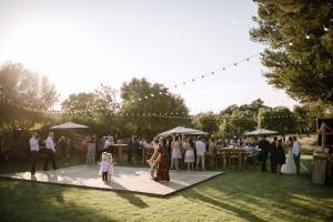 a group of people standing on a dance floor at a wedding at Son French in Algaida +25 photos
