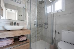 a bathroom with a sink and a glass shower at Casa Sol 21 A Garachico in Garachico +19 photos