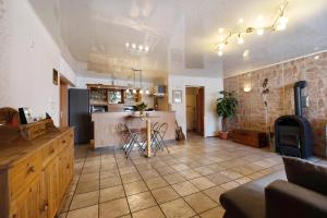 a large room with a kitchen and a table in it at Ferienwohnung Wiesental in Meisburg