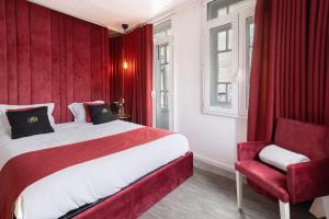 a hotel room with a large bed and a chair at Prestigegoldresidence 2 - Old Town in Guimarães