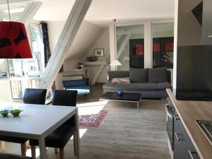 a living room with a couch and a table at Ferienwohung Rotkehlchen in Kurort Gohrisch