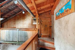 a room with wood paneling and a wooden wall at Dolomites Chalet Pian in Campitello di Fassa +20 photos