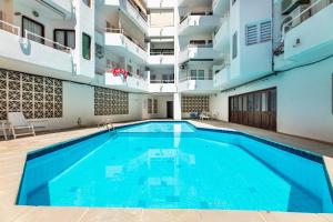 a swimming pool in the middle of a building at Voramar in Pollença