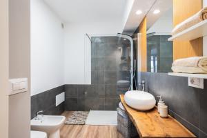 a bathroom with a sink and a toilet and a shower at Casa Cenate in Nardò +17 photos