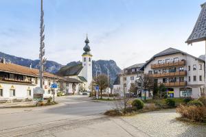 a street in a town with a clock tower at Chalet Gipfelblick Inzell in Inzell
