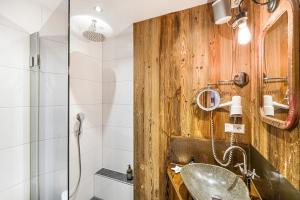 a bathroom with a sink and a shower at Chalet Gipfelblick Inzell in Inzell +20 photos