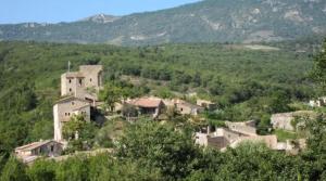 a group of houses on a hill with trees at Le Cigalou - Drôme Provencale in Sainte-Jalle